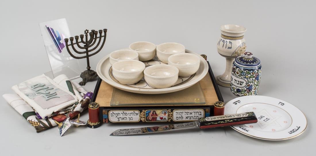 Miscellaneous Group of Judaica Table Articles: Including a menorah, a kiddush cup, a mezuzah, etc. Tallest height 6 3/4 inches. Notice to bidders: Condition reports and additional photographs are provided by request as a courtesy to our clients, a