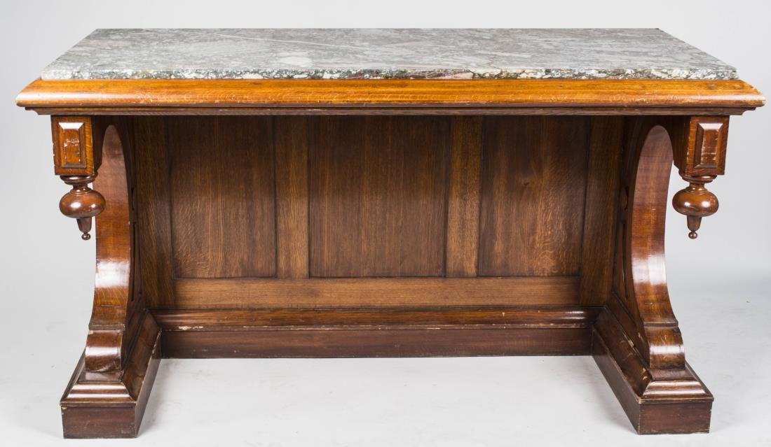 Marble Top Walnut Commode: Rectangular green marble inset top, on scrolled supports with toupie finial decoration. Height 36 inches, width 64 inches, depth 27 inches. Notice to bidders: Condition reports and additional photogra