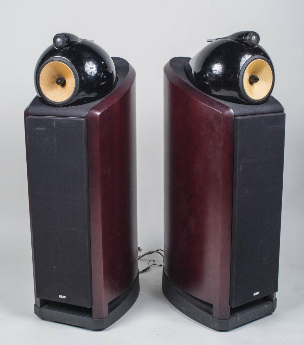Pair of B&W Nautilus 802 Speakers: Cherry case. Height 44 inches. Notice to bidders: Condition reports and additional photographs are provided by request as a courtesy to our clients, as such any condition report is only an opinion and