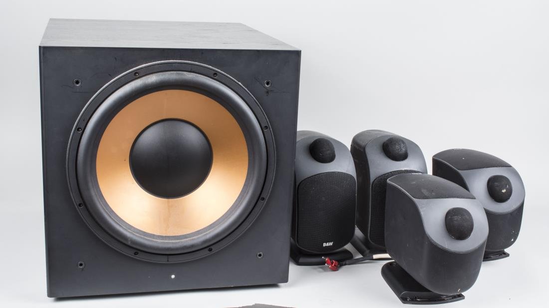 Subwoofer and Speakers: Comprising a Klipsch subwoofer and a set of four B&W LM1 speakers. Notice to bidders: Condition reports and additional photographs are provided by request as a courtesy to our clients, as such any con