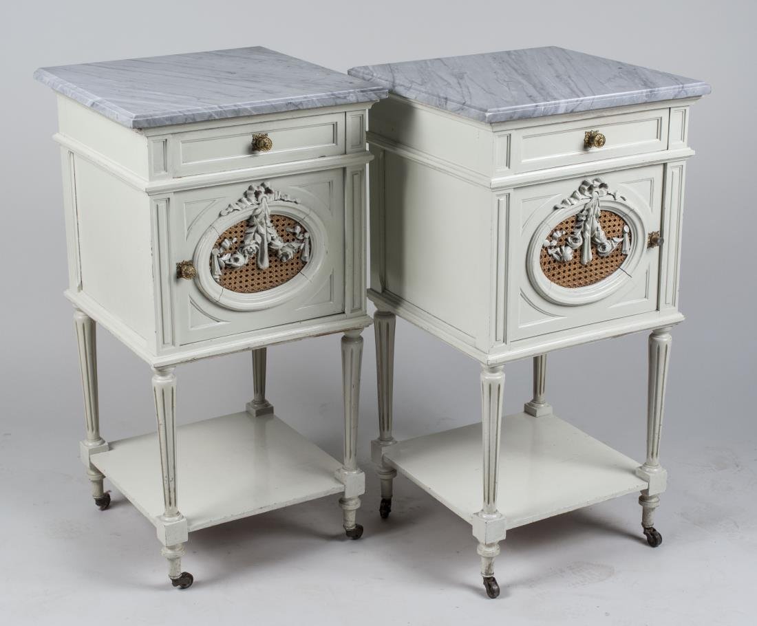Pair of Marble Top Night Stands: Grey veined white marble tops on white painted cabinets with a drawer above a single door cabinet, on turned legs joined by a low shelf. Height 32 1/2 inches, width 17 1/4 inches, depth 17 inches. Not
