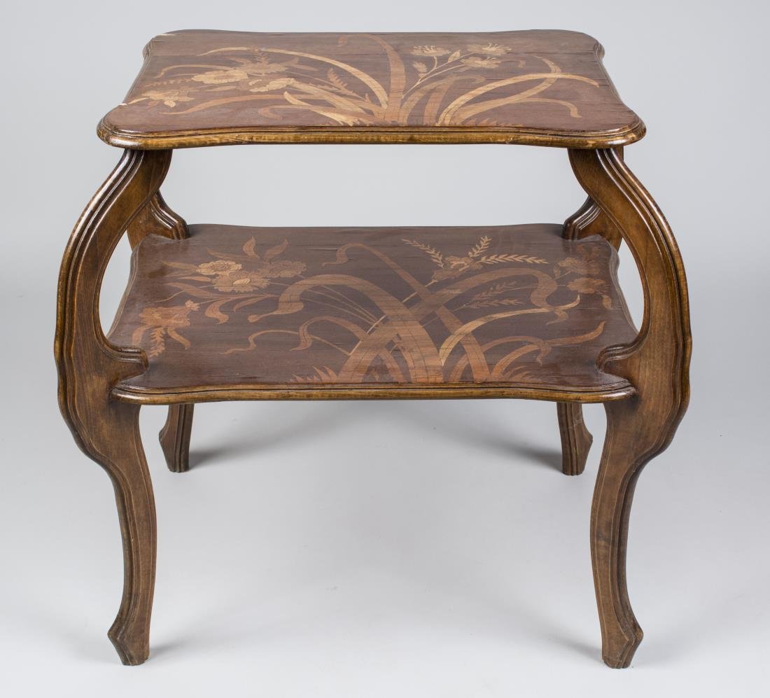 Art Nouveau Style Two Tier Occasional Table: In the manner of Emile GallÃ© (French, 1846-1904), with a shaped rectangular top on four cabriole legs joined by a larger conforming medial shelf. Height 30 inches, width 31 inches, depth 20 inches.