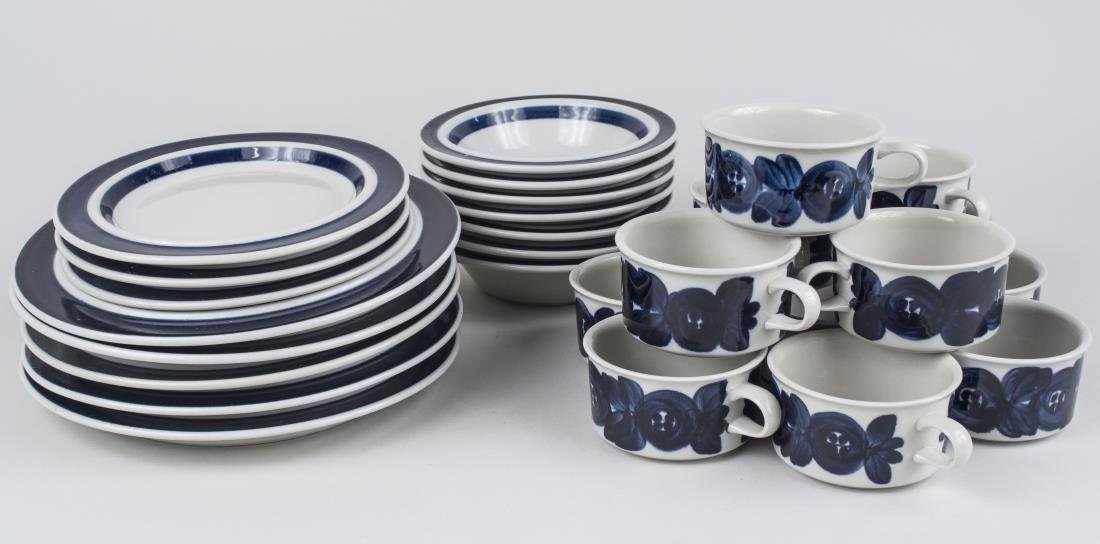 Arabia Stoneware Partial Dinner Service: Approximately forty two pieces, Anemone Blue pattern, comprising five dinner plates, ten salad plates, seven bowls, thirteen cups, and seven saucers. Dinner plate diameter 10 1/4 inches. Notice to bid