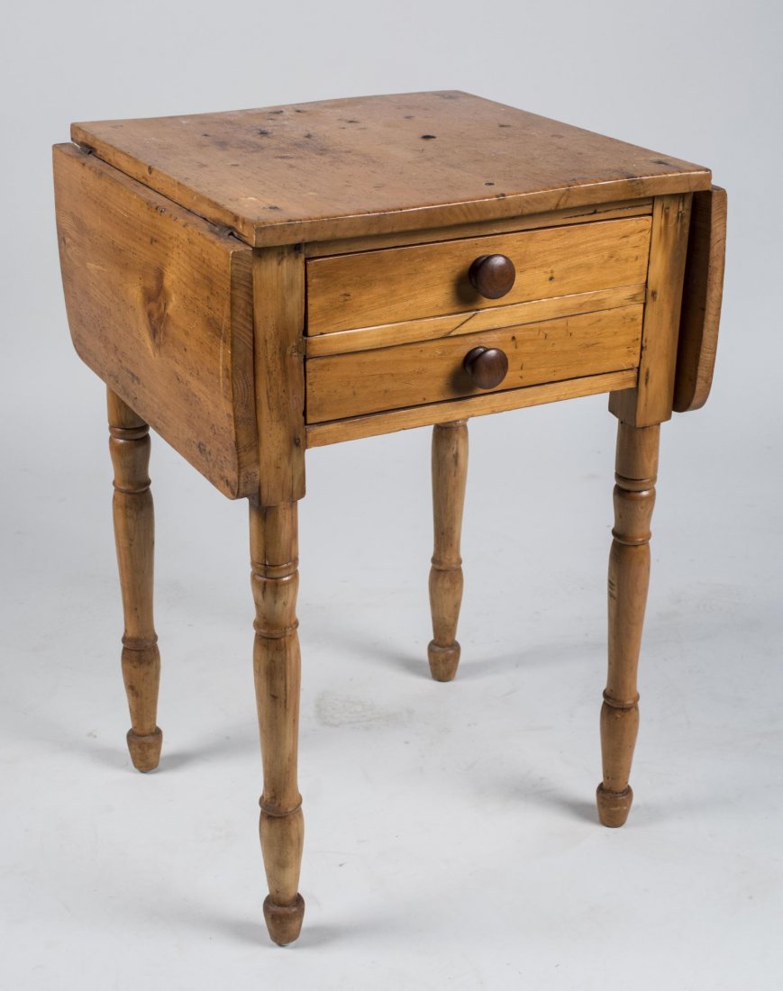 Fruitwood Drop Leaf Work Table: 19th century, rectangular top flanked by two leaves above two drawers, turned legs. Height 29 1/4 inches, width extended 36 inches, depth 18 inches. Notice to bidders: Condition reports and additional
