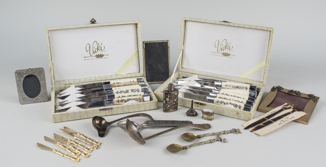 Miscellaneous Group of Table Articles: Including two boxed sets of steak knives, three miniature picture frames, Mexican silver overlay perfume bottle, tortoise shell set, set of gold tone hors d'oeurve knives, etc. Notice to bidders: Cond