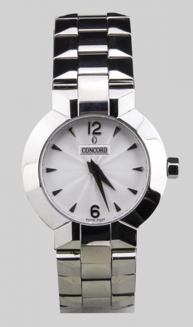 Lady's Concord Watch: Guilloche enamel dial with Arabic 12 and 6 and baton hours, signed, no.14 G4 1843 and 1139510, stainless steel band. Notice to bidders: Condition reports and additional photographs are provided by req