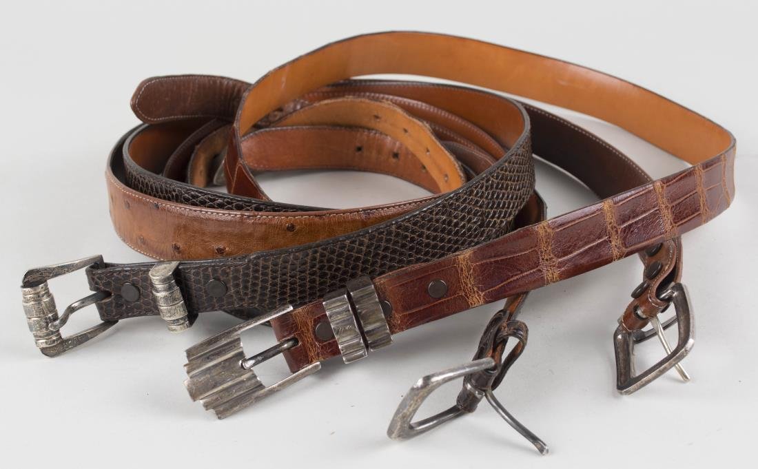 Collection of Four Gentleman's Belts: Comprising an Ostrich belt with Magnus sterling silver buckle, size 38; a James Reid Ltd. alligator belt with sterling buckle, size 40, a Ralph Lauren Polo alligator belt with sterling silver buckle,