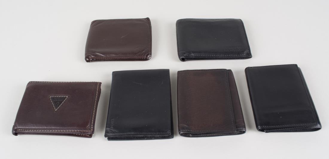 Six Vintage Designer Wallets: Various makers, including Nautica, two Kenneth Cole Reaction, DKNY, Pierre Cardin and Guess. Notice to bidders: Condition reports and additional photographs are provided by request as a courtesy to ou