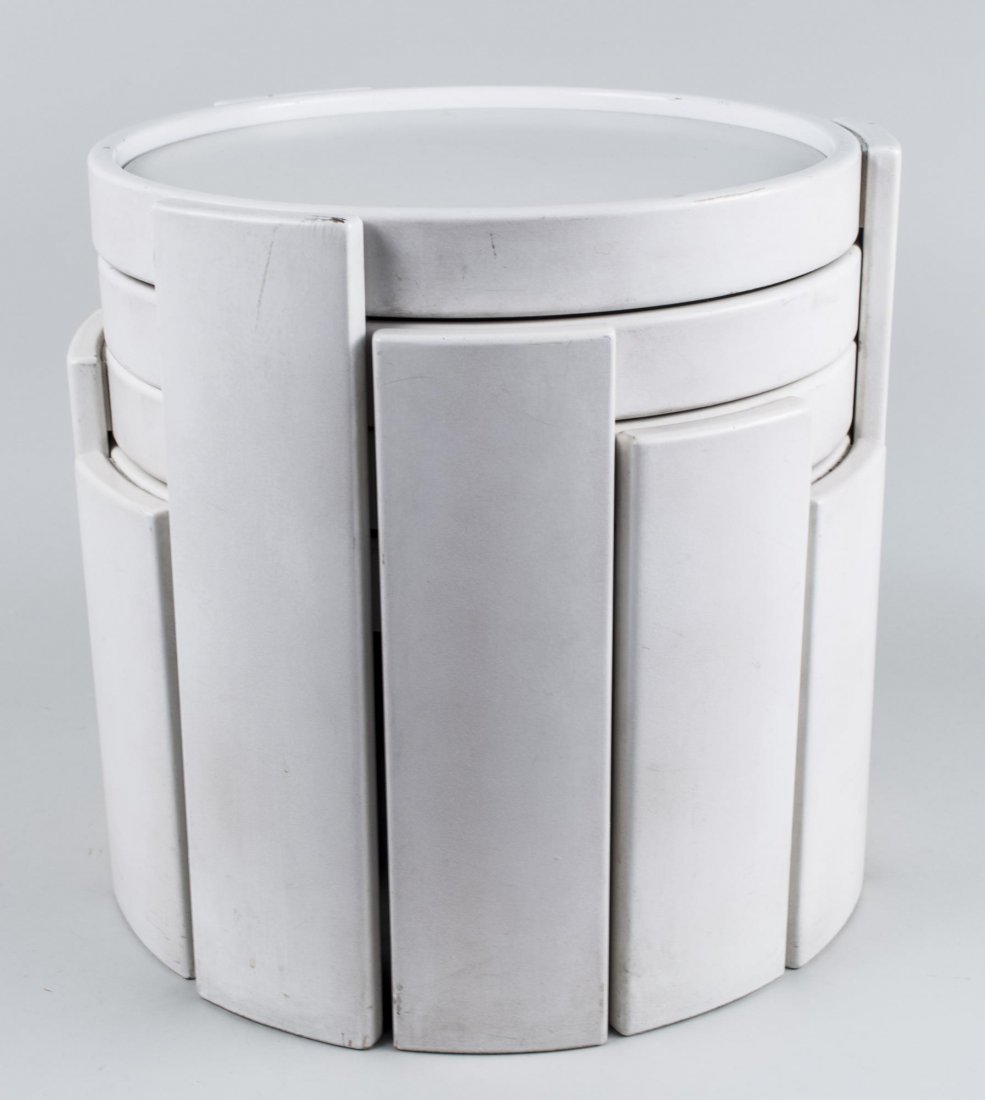 Set of Mid Century Stacking Tables: White plastic, in the style of Kartell. Height 16 inches, diameter 16 inches. Provenance: The Estate of Melvin Bernhardt Notice to bidders: Condition reports and additional photographs are provided by