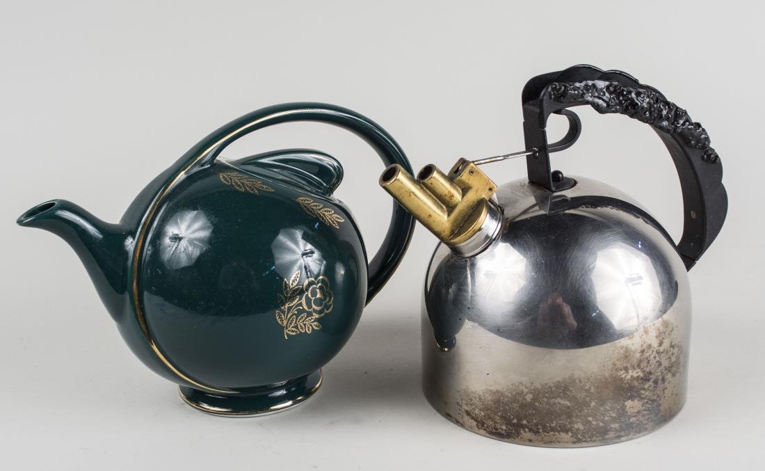 Alessi Tea Kettle: Together with a ceramic teapot. Height 7 3/4 inches. Notice to bidders: Condition reports and additional photographs are provided by request as a courtesy to our clients, as such any condition report 