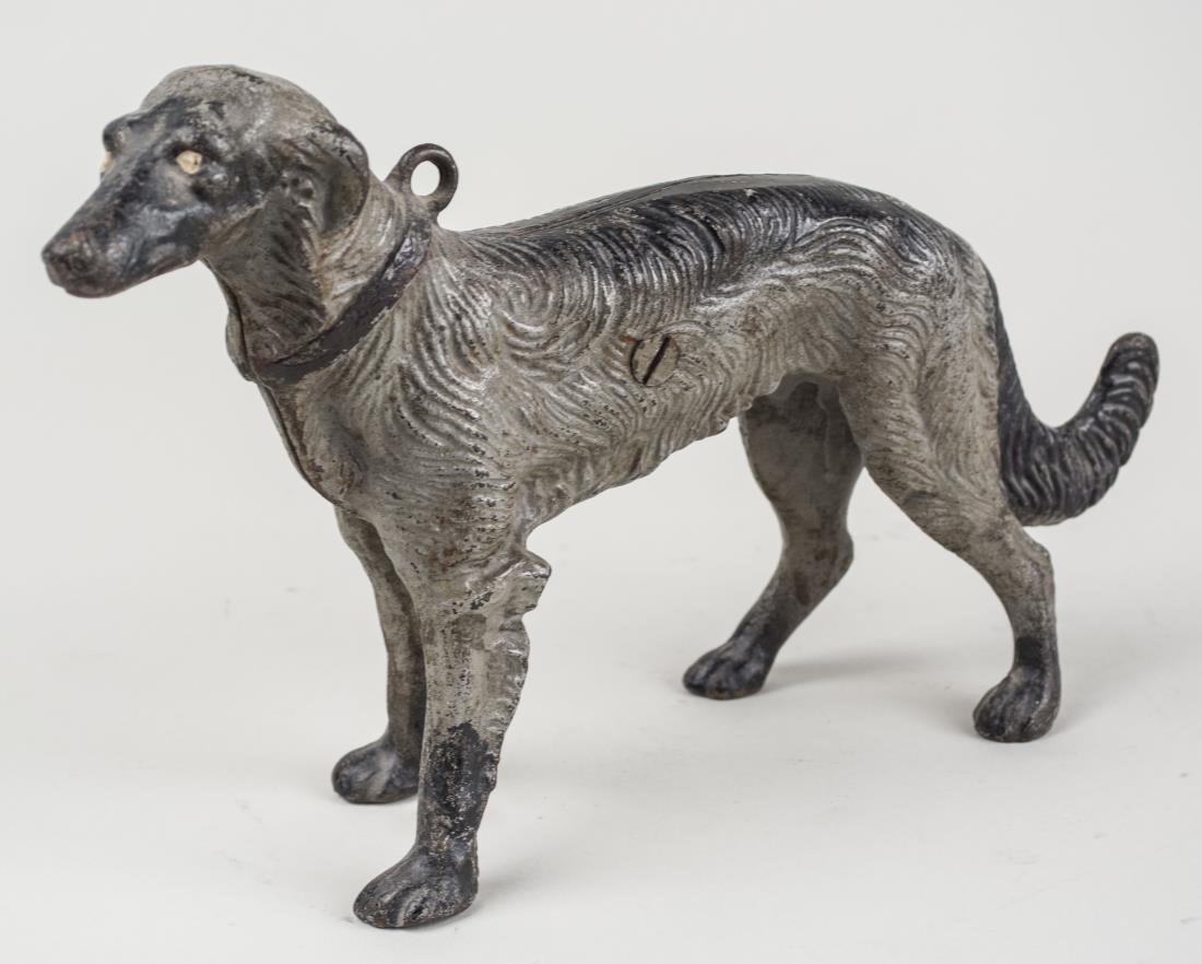 Cast Iron Dog: Cold painted. Height 8 inches. Notice to bidders: Condition reports and additional photographs are provided by request as a courtesy to our clients, as such any condition report is only an opinion and