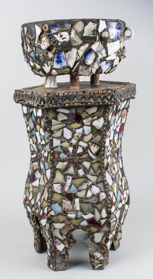 Tramp Art Ceramic Jardiniere and Stand: Bowl and stand decorated with pieces of broken pottery and porcelain. Height overall 26 1/2 inches. Provenance: The Estate of Melvin Bernhardt Notice to bidders: Condition reports and additional photo