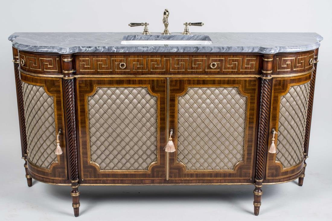Louis XVI Style Marble Top Cabinet: Converted to a sink, grey marble top on a parcel gilt mahogany base with four grilled doors, on turned legs. Height 46 inches, width 70 inches, depth 20 inches. Notice to bidders: Condition reports an