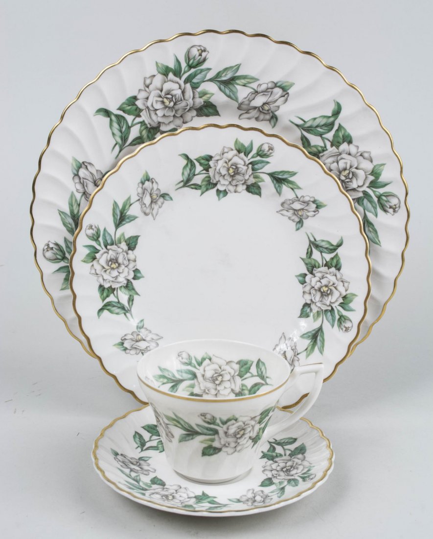 Syracuse China Porcelain Dinner Service: Gardenia pattern, comprising twelve dinner plates, eleven salad plates, eleven soup plates,twelve bread plates, twelve fruit bowls, twelve cups and saucers. Dinner plate, diameter 10 1/4 inches. Prove