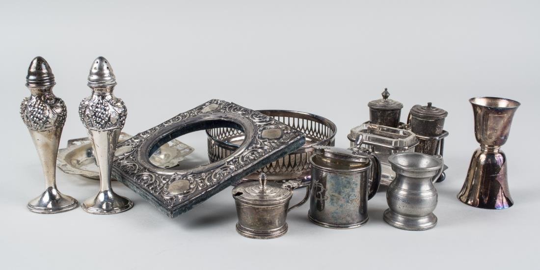 Group of Sterling and Silver Plated Table Articles: Comprising an English silver mustard pot and picture frame, silver plated wine bottle coaster, condiment set, pair of shakers, jigger, and mustard pot. Shakers, height 5 inches. Notice to bidders: Con