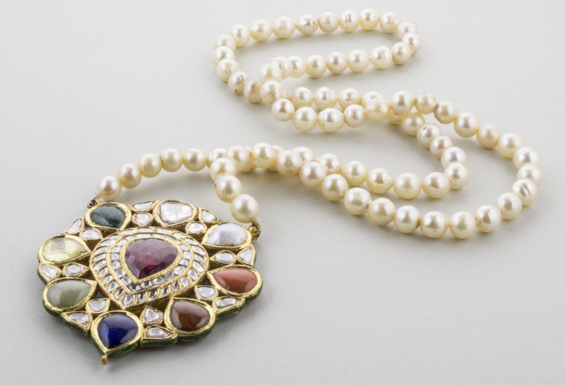 Mughal Pearl and Gemstone Necklace *: High carat gold pendant with nine precious stones as per Hindu mythology, of ruby, emerald, chrysoberyl, pearl, diamond and blue and yellow sapphire, elaborate enamel decoration on the back. the penda