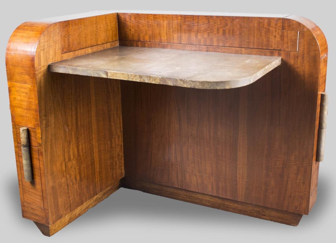 Art Deco Desk: Asymmetrical design with shagreen writing surface and various hidden drawers and fitted compartments. Height 36 inches, width 43 inches, depth 29 inches. Notice to bidders: Condition reports and addit