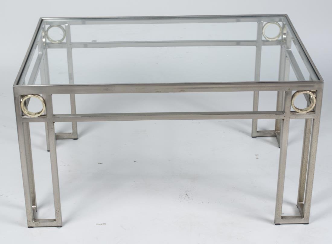 Glass Top Coffee Table: Rectangular top on a steel base with brass accents. Height 17 inches, width 30 inches, depth 20 inches. Provenance: The Estate of Melvin Bernhardt Notice to bidders: Condition reports and additional p