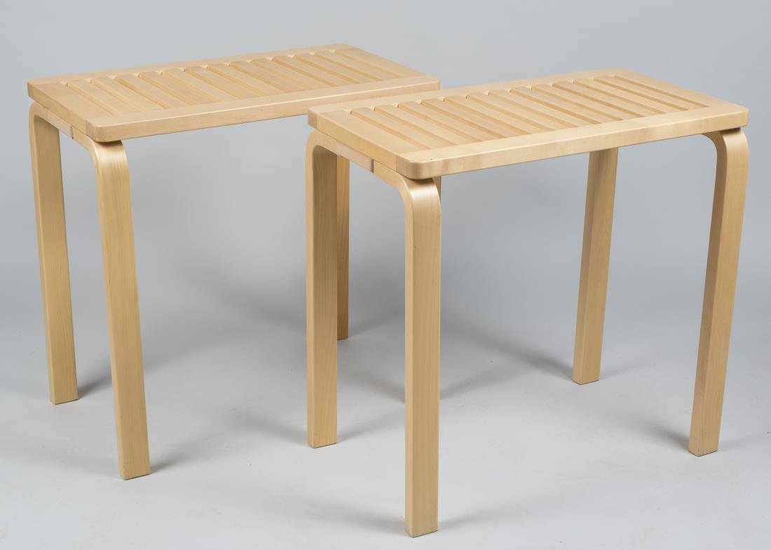Pair of Alvar Aalto Artek 153B End Tables: Each with slatted rectangular top with rounded corners, on two pairs of bent wood legs. Height 28 inches, width 29 inches, depth 16 inches. Notice to bidders: Condition reports and additional photogra