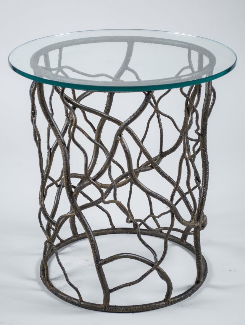 Glass Top Twig Table: Circular glass top on a twig form metal base. Height 24 inches, diameter 22 inches. Notice to bidders: Condition reports and additional photographs are provided by request as a courtesy to our clients