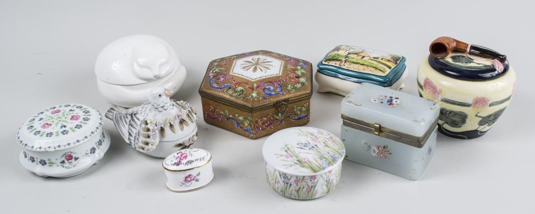 Group of Porcelain Trinket Boxes: Various makers and examples, including Limoge porcelain, an Opaline glass box, etc. Various sizes. Notice to bidders: Condition reports and additional photographs are provided by request as a courtesy