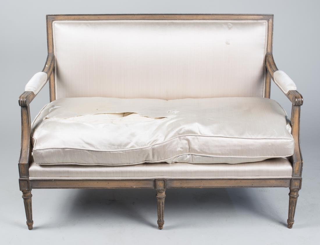 Louis XVI Style Settee: Rectangular back, padded open arms, cushion seat and tapered fluted legs. Height 34 inches, width 48 inches, depth 25 inches. Notice to bidders: Condition reports and additional photographs are provid