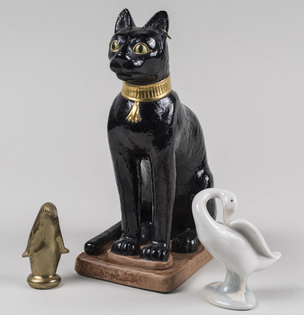 Boehm Egyptian Cat & Lladro Duck: Together with a brass penguin. Cat, height 10 1/4 inches. Provenance: Warren Means Trust Notice to bidders: Condition reports and additional photographs are provided by request as a courtesy to our cl