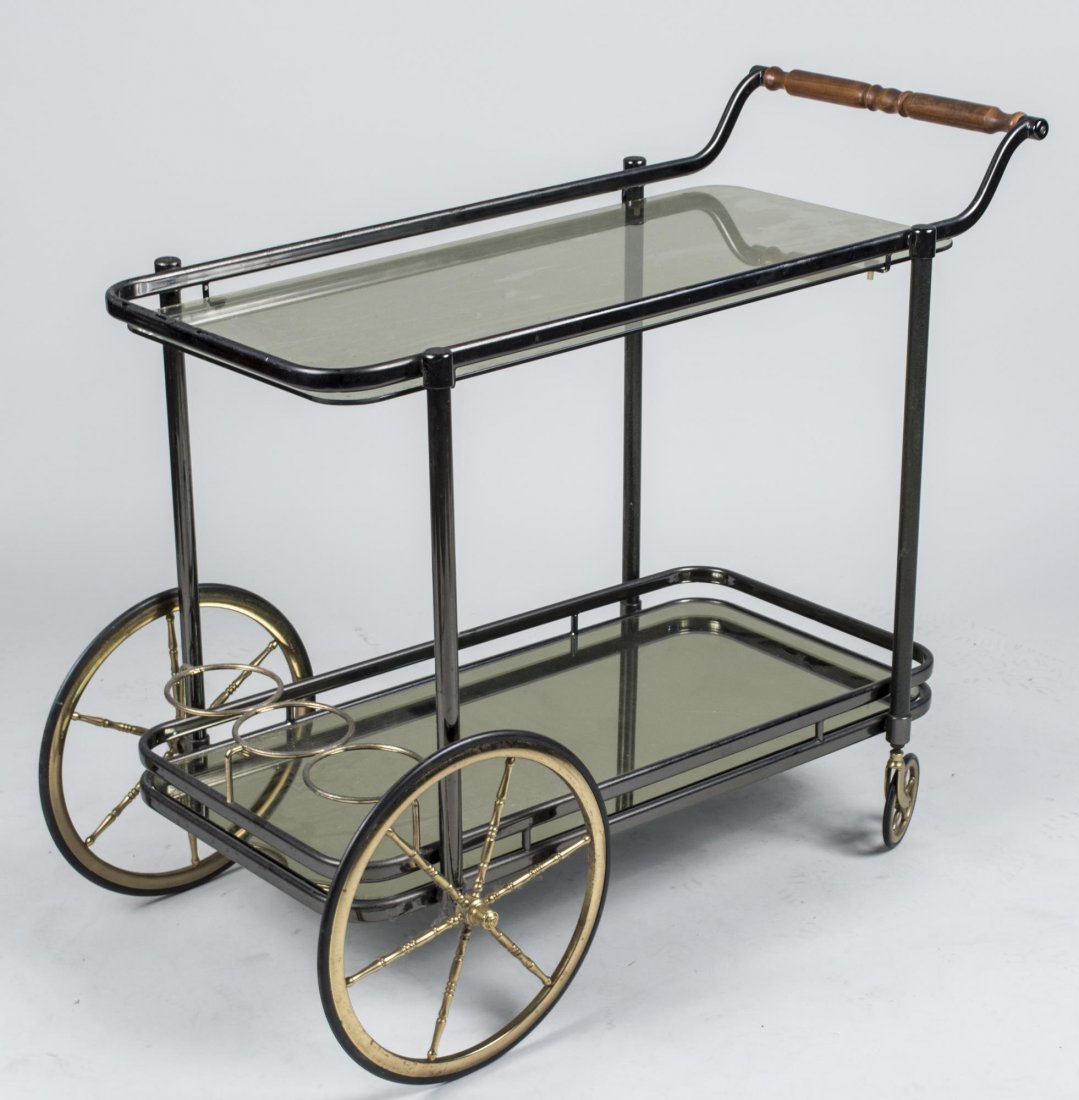 Brass and Glass Bar Cart: Two rectangular glass shelves. Height 30 inches, width 17 inches, depth 34 inches. Notice to bidders: Condition reports and additional photographs are provided by request as a courtesy to our clients,
