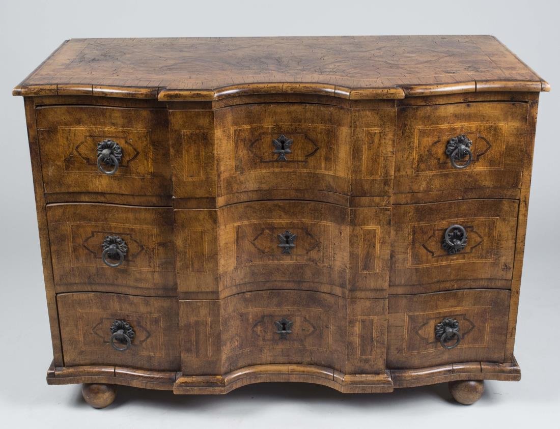 Continental Burl Wood Commode: Oxbow fronted top over three inlaid drawers, ball feet. Height 32 inches, width 45 inches, depth 22 inches. Notice to bidders: Condition reports and additional photographs are provided by request as a