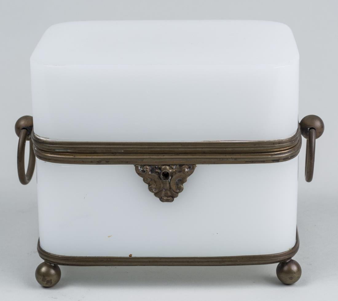 French White Opaline Glass Dresser Box: Gilt bronze mounted box. Height 5 1/2 inches, width 6 inches, depth 4 1/4 inches. Notice to bidders: Condition reports and additional photographs are provided by request as a courtesy to our clients,