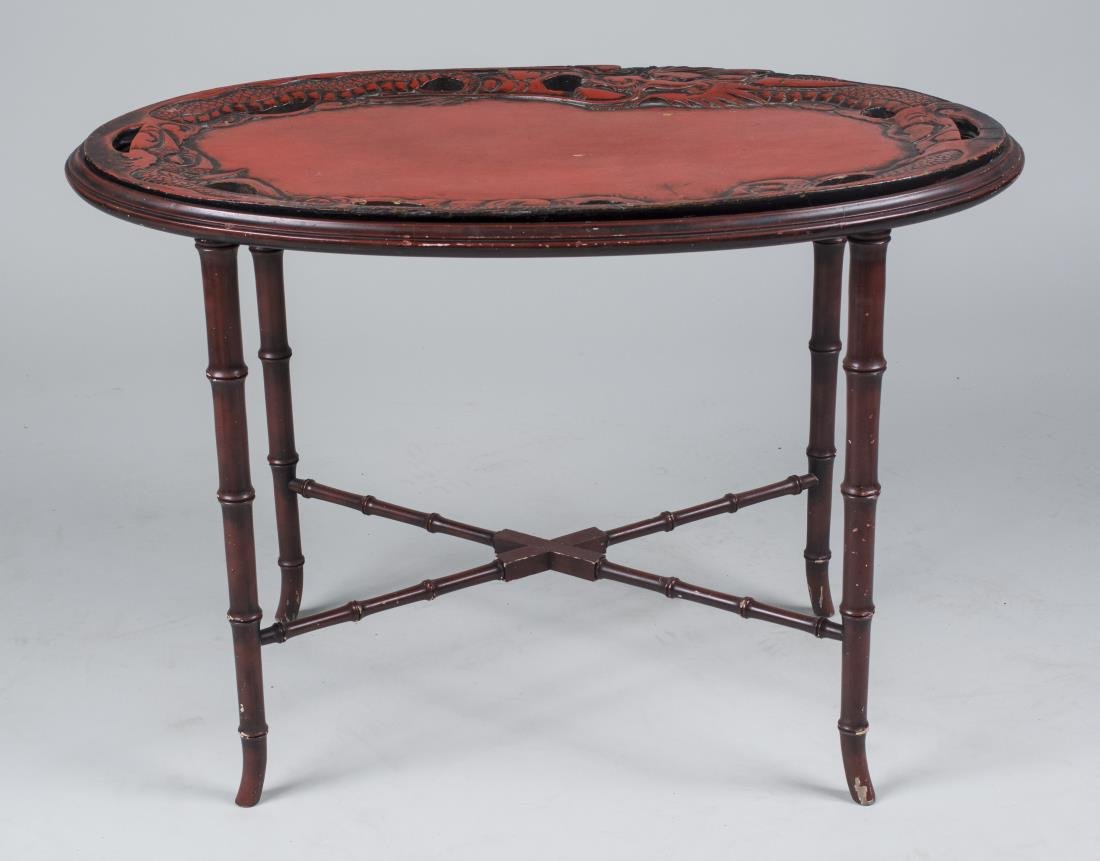 Tray Top Low Table: Oval top on a faux banboo base. Height 21 inches, width 30 inches, depth 17 inches. Notice to bidders: Condition reports and additional photographs are provided by request as a courtesy to our clients