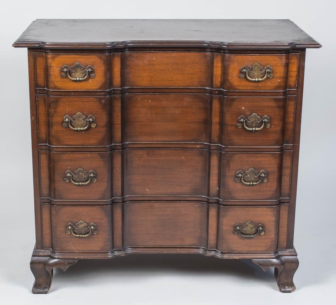 Mahogany Chest of Drawers: Oxbow fronted rectangular top over four drawers, ogee bracket feet, label in drawer stating, 'Hand Made in Charak Furniture Co., Boston Mass., #3779, made year 1947. Height 35 inches, width 38 inches,