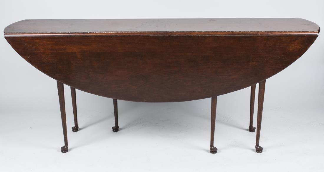 Irish Mahogany Wake Table: Shaped rectangular with two drop leaves, tapered turned legs ending in pad feet. Closed height 30 inches, width 72 inches, depth 17 inches. Notice to bidders: Condition reports and additional photogra