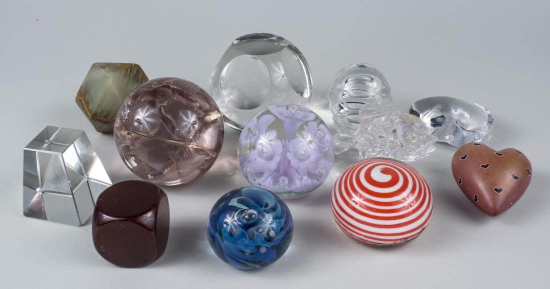 Collection of Glass Paperweights: Various styles, some glass, ceramic, etc. Various sizes. Provenance: Warren Means Trust Notice to bidders: Condition reports and additional photographs are provided by request as a courtesy to our cli