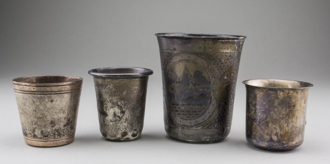 Russian Silver Wine Cup: Marked 84, with engraved decoration, together with three small wine cups, including two sterling silver cups and a Christofle silver plated cup. Russian cup, height 2 3/4 inches.. Notice to bidders: C