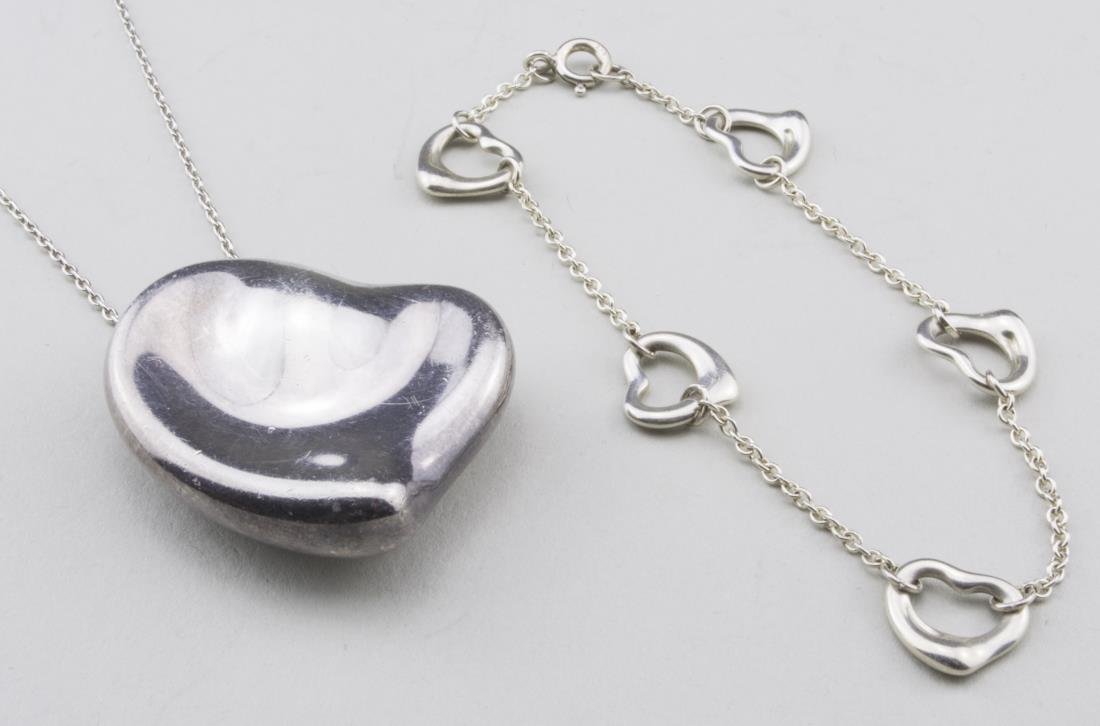 Tiffany & Co. Sterling Silver Necklace & Bracelet: Both Elsa Perretti, one a fine chain suspending a heart pendant, the other a chain bracelet with five hearts. Length 7 inches. Notice to bidders: Condition reports and additional photographs are provi