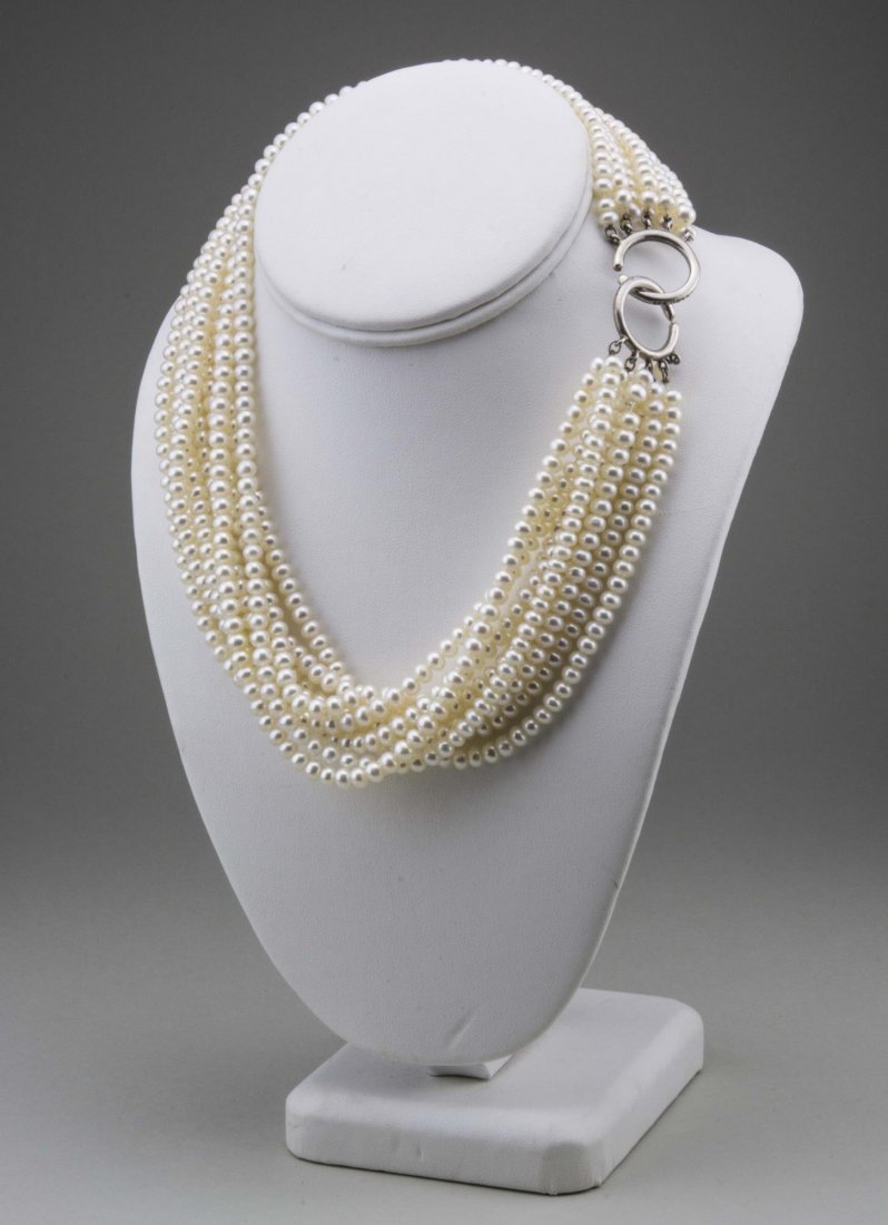 Tiffany & Co. Paloma Picasso Pearl Necklace: Nine strands of cultured pearls finished with a sterling silver clasp, signed. Length 18 inches. Notice to bidders: Condition reports and additional photographs are provided by request as a courtesy t