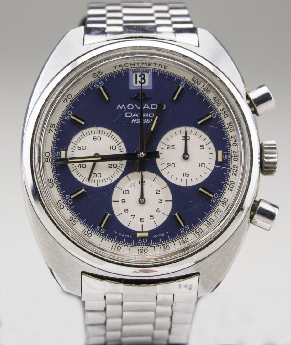 Movado Datron Chronograph: Blue dial with baton hours and three subsidiary dials, stainless steel band. Notice to bidders: Condition reports and additional photographs are provided by request as a courtesy to our clients, as su