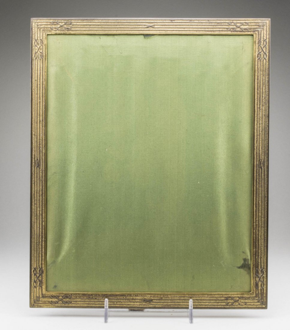 Tiffany Studio Bronze Picture Frame: Numbered 1868, holds 8 x 10 photograph. Notice to bidders: Condition reports and additional photographs are provided by request as a courtesy to our clients, as such any condition report is only an op