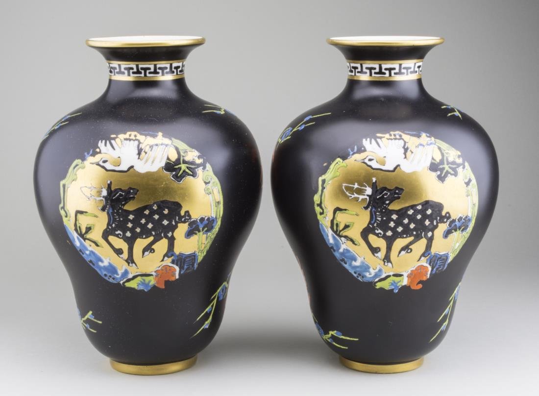 Pair of Royal Worcester Porcelain Vases: Inverted pyriform vases with stylized animal decoration. Height 8 1/2 inches. Notice to bidders: Condition reports and additional photographs are provided by request as a courtesy to our clients, as s