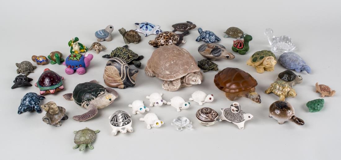 Miscellaneous Group of Turtle Figurines: Approximately forty two pieces, glass, seashell, pottery, composite and metal examples, including a Lalique amber glass figure. Various sizes. Notice to bidders: Condition reports and additional photo