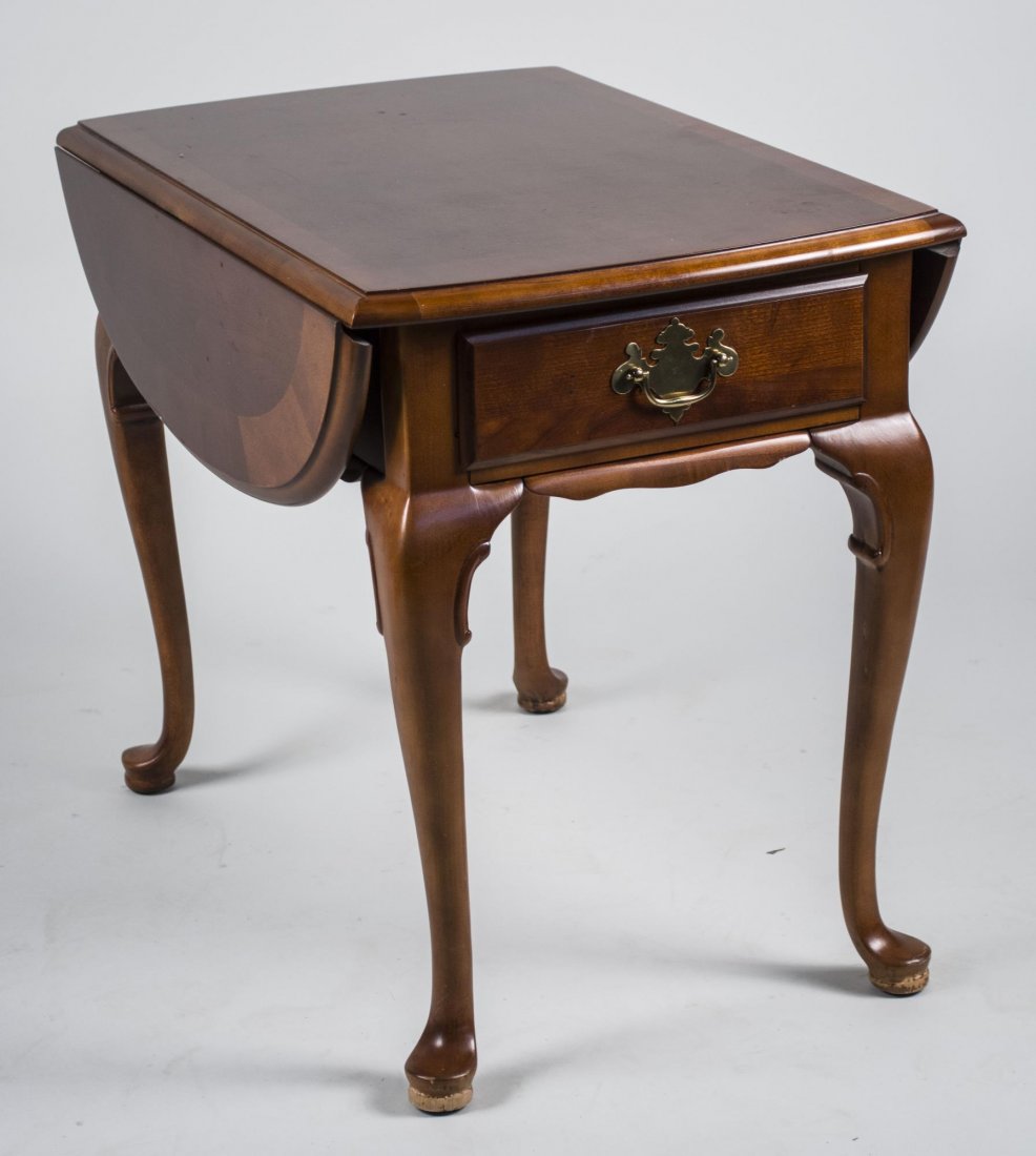 American Craftsman Mahogany Pembroke Table: Shaped rectangular top with drop leaves, over a drawer, cabriole legs ending in pad feet. Height 23 inches, width 27 inches, depth 18 1/2 inches. Leaf 8 1/2 inches. Notice to bidders: Condition report