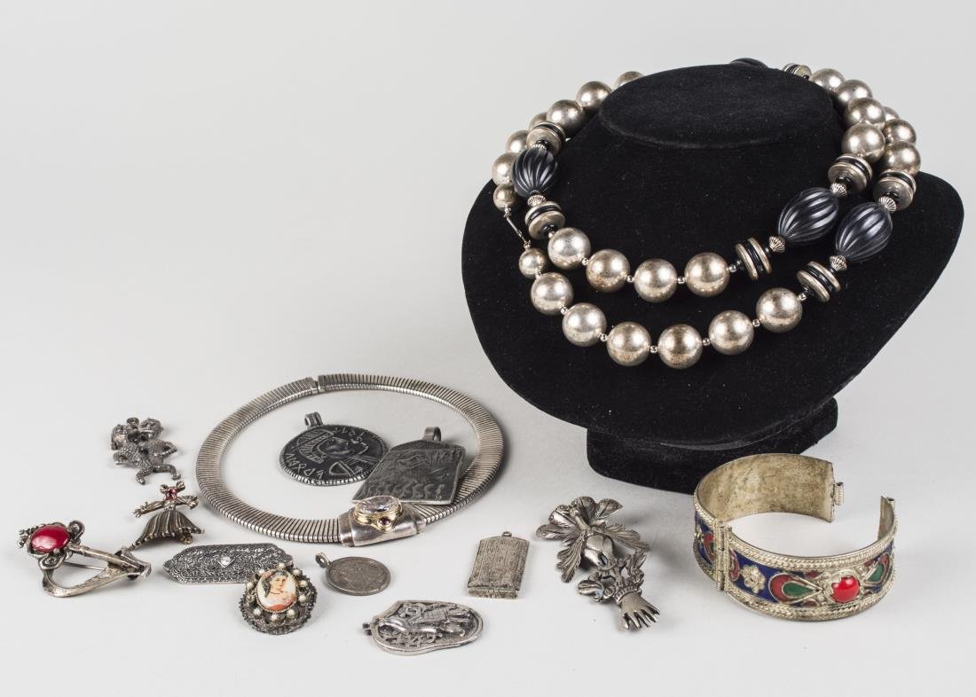 Group of Silver and Silver Tone Jewelry: Including a bead necklace, bangle, snake necklace, various pendant and pins, etc., necklace, length 32 inches. Notice to bidders: Condition reports and additional photographs are provided by request a