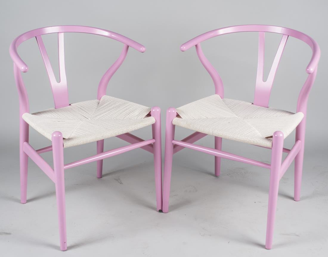 Pair of Hans Wegner Pink Wishbone Chairs: Created in 2010 to benefit the Cancer Research Foundation. Height 32 inches, width 22 inches, depth 20 inches. Notice to bidders: Condition reports and additional photographs are provided by request a