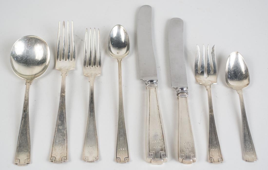 Gorham Sterling Silver Flatware Set: Etruscan pattern, comprising six dinner knives, five luncheon knives, six dinner forks, five luncheon forks, eleven salad forks, nine iced tea spoons, eleven teaspoons, six cream soup spoons, two serv