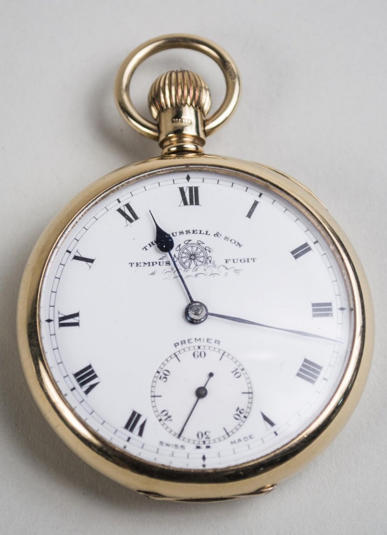 English Gold Pocket Watch: 10k yellow gold watch, white enamel dial signed Thls Russell & Son, Tempus Fugit, Roman numerals, subsidiary seconds dial, case marked Chester and .375. Diameter 1 3/4 inches. Notice to bidders: Condi