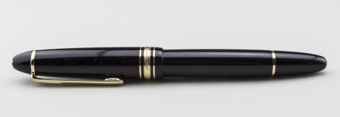 Montblanc Fountain Pen: Meisterstuck, No. 146. black with gold tone trim and clip, Mont Bland 4810 14k gold nib. Length 5 1/2 inches. Notice to bidders: Condition reports and additional photographs are provided by request as