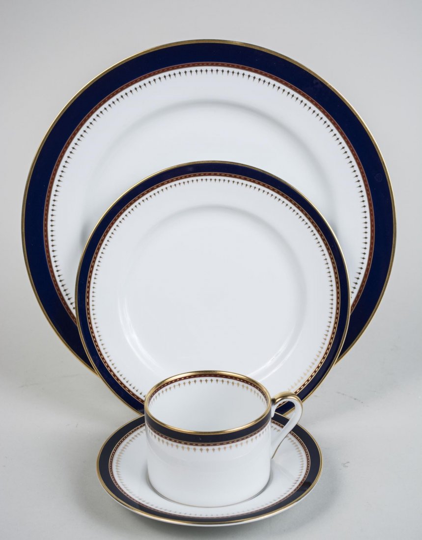 Fitz and Floyd Porcelain Dinner Service: Starburst pattern, comprising thirteen dinner plates, eleven salad plates, eight soup plates, nine bread plates, nine cups and saucers, platter, cream and sugar and an octagonal serving bowl; together