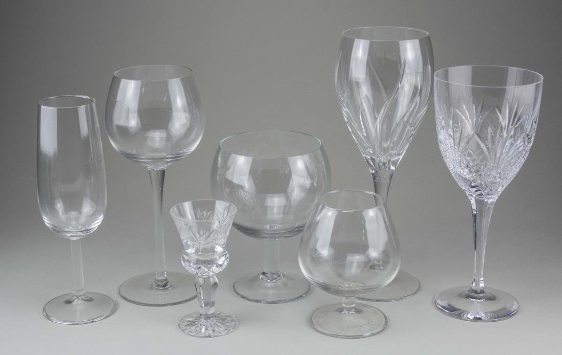 Group of Stemware and Barware: Approximately forty one pieces, various makers and patterns, including champagne flutes, wine glasses, cordials, etc. Tallest height 8 3/4 inches. Notice to bidders: Condition reports and additional p