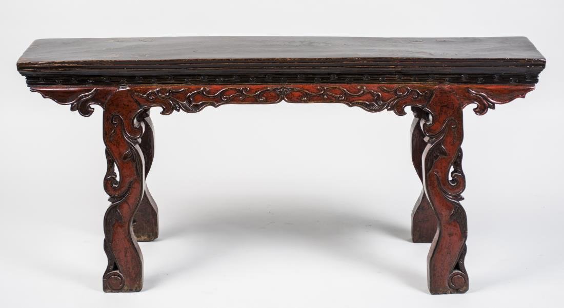 Chinese Low Altar Table: Rectangular natural wood top on red lacquered base. Height 22 inches, width 47 inches, depth 9 inches. Notice to bidders: Condition reports and additional photographs are provided by request as a cour